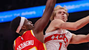 Toronto Raptors guard Gradey Dick shoots past Atlanta Hawks forward Onyeka Okongwu.