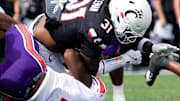 Northwestern State Demons defensive end Jeremiah Bodwin (7) tackles Cincinnati Bearcats linebacker Simeon Coleman (31) in the first quarter of a NCAA men’s college football game between the Cincinnati Bearcats and Northwestern State Demons, Saturday, Sept. 13, 2025, at Nippert Stadium in Cincinnati. Bearcats are up 56-0 by halftime.