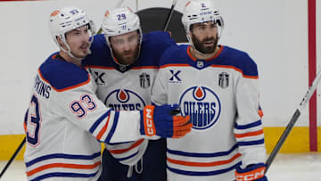 Jun 12, 2025; Sunrise, Florida, USA; Edmonton Oilers center Ryan Nugent-Hopkins (93) celebrates scoring with center Leon Draisaitl (29) and defenseman Evan Bouchard (2) during the second period against the Florida Panthers  in game four of the 2025 Stanley Cup Final at Amerant Bank Arena. Mandatory Credit: Jim Rassol-Imagn Images