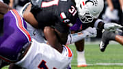 Northwestern State Demons defensive end Jeremiah Bodwin (7) tackles Cincinnati Bearcats linebacker Simeon Coleman (31) in the first quarter of a NCAA men’s college football game between the Cincinnati Bearcats and Northwestern State Demons, Saturday, Sept. 13, 2025, at Nippert Stadium in Cincinnati. Bearcats are up 56-0 by halftime.
