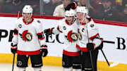 Apr 5, 2022; Montreal, Quebec, CAN; Ottawa Senators right wing Drake Batherson (19) celebrates his goal against Montreal Canadiens with teammates left wings Tim Stutzle (18) and Brady Tkachuk (7) during the third period at Bell Centre. Mandatory Credit: Jean-Yves Ahern-Imagn Images