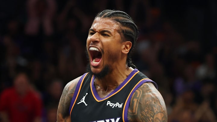 Apr 17, 2026; Phoenix, Arizona, USA; Phoenix Suns guard Jalen Green (4) celebrates after a slam dunk against the Golden State Warriors during the first half in the play-in rounds of the 2026 NBA Playoffs at Mortgage Matchup Center. Mandatory Credit: Mark J. Rebilas-Imagn Images