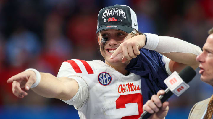 Dec 30, 2023; Atlanta, GA, USA; Mississippi Rebels quarterback Jaxson Dart (2) celebrates after a victory against the Penn State Nittany Lions in the Peach Bowl at Mercedes-Benz Stadium. Mandatory Credit: Brett Davis-USA TODAY Sports