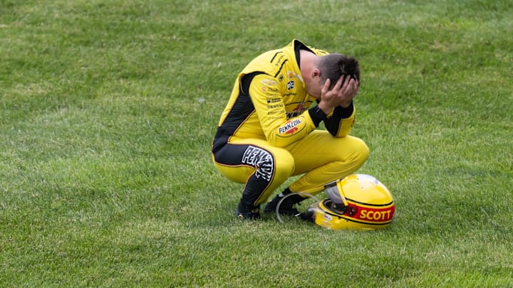 IndyCar Series driver Scott McLaughlin reacts after crashing on the pace lap of the 109th Running of the Indianapolis 500.