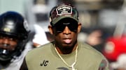 Nov 11, 2023; Boulder, Colorado, USA; Colorado Buffaloes head coach Deion Sanders runs on to the field before the first half against the Arizona Wildcats at Folsom Field. Mandatory Credit: Ron Chenoy-Imagn Images