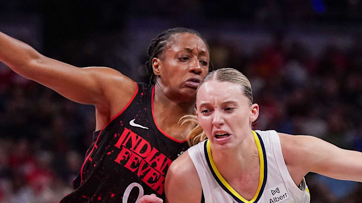 Indiana Fever guard Kelsey Mitchell rushes up the court against Dallas Wings guard Paige Bueckers. Indiana Fever guard Kelsey Mitchell rushes up the court against Dallas Wings guard Paige Bueckers.