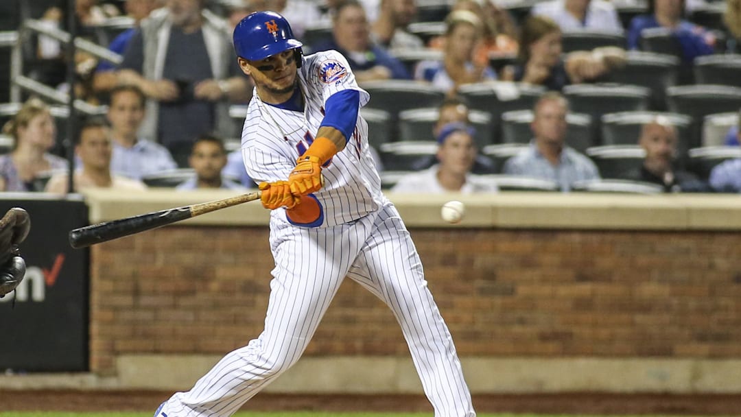 Aug 21, 2019; New York City, NY, USA; New York Mets center fielder Juan Lagares (12) hits an RBI double against the Cleveland Indians in the fifth inning at Citi Field. Mandatory Credit: Wendell Cruz-Imagn Images Aug 21, 2019; New York City, NY, USA; New York Mets center fielder Juan Lagares (12) hits an RBI double against the Cleveland Indians in the fifth inning at Citi Field. Mandatory Credit: Wendell Cruz-Imagn Images