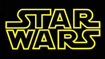 In this photo illustration, a Star Wars logo is seen on a...