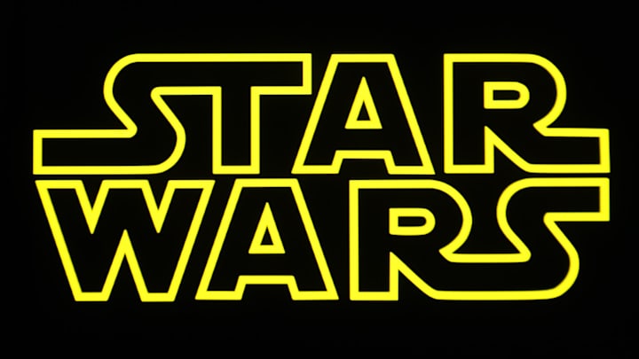In this photo illustration, a Star Wars logo is seen on a...