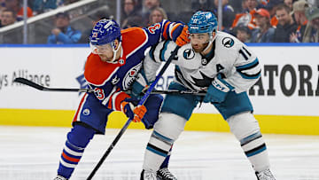 Edmonton Oilers forward Victor Arvidsson (33) and San Jose Sharks forward Luke Kunin (11) 