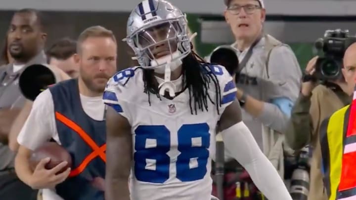 CeeDee Lamb reacts to an errant pass from Cooper Rush.