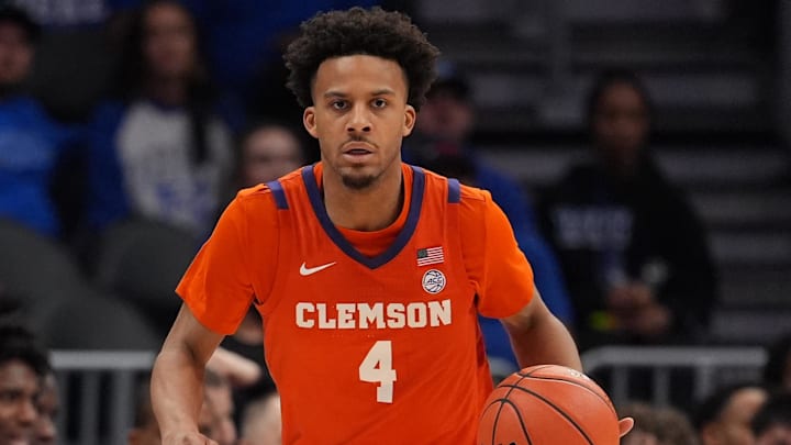 Mar 13, 2026; Charlotte, NC, USA; Clemson Tigers guard Efrem Johnson (4) brings the ball up court against the Duke Blue Devils during the second half at Spectrum Center. Mandatory Credit: Jim Dedmon-Imagn Images
