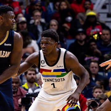 Dec 28, 2022; New Orleans, Louisiana, USA; New Orleans Pelicans forward Zion Williamson (1) looks to pass against Minnesota Timberwolves guard Anthony Edwards (1) during the second half at Smoothie King Center. 