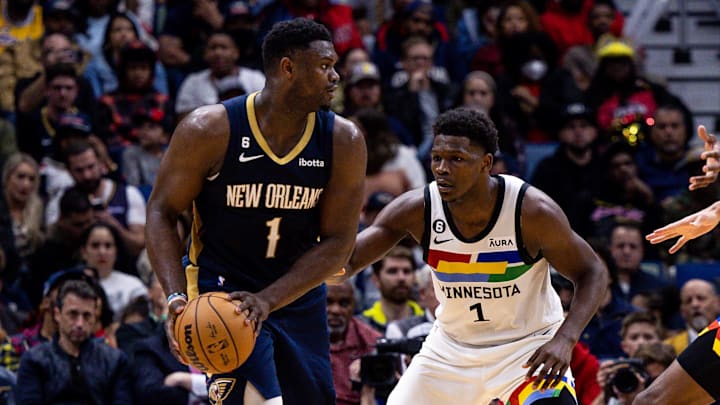 Dec 28, 2022; New Orleans, Louisiana, USA; New Orleans Pelicans forward Zion Williamson (1) looks to pass against Minnesota Timberwolves guard Anthony Edwards (1) during the second half at Smoothie King Center. 