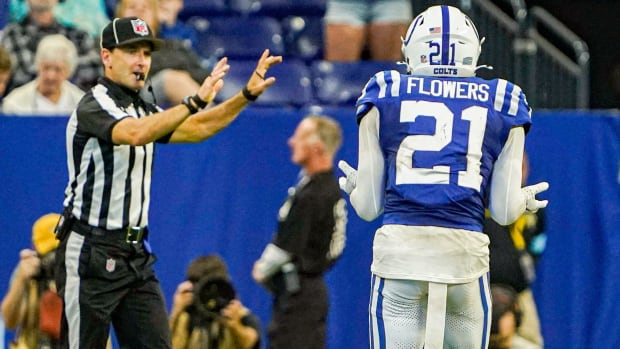 Colts cornerback Dallis Flowers (blue jersey and white helmet) argues with the referee after a penalty was called. 