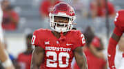 Oct 26, 2024; Houston, Texas, USA; Houston Cougars defensive back Jeremiah Wilson (20) reacts after making a tackle during the first quarter against the Utah Utes at TDECU Stadium. Mandatory Credit: Troy Taormina-Imagn Images