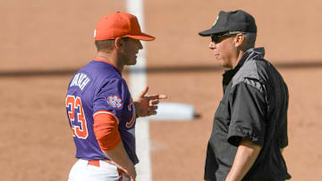 Mar 1, 2025; Greenville, South Carolina, USA; Clemson Tigers head coach Erik Bakich talks to an umpire about a call during the game against the South Carolina Gamecocks during the bottom of the sixth inning at Fluor Field.