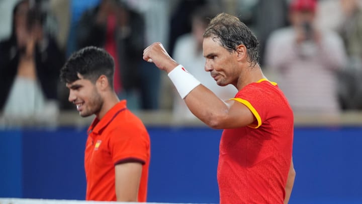 Spain's Carlos Alcaraz and Rafael Nadal celebrate a point at the 2024 Paris Olympics. Spain's Carlos Alcaraz and Rafael Nadal celebrate a point at the 2024 Paris Olympics.