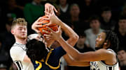 Vanderbilt’s Tyler Nickel, left, and Devin McGlockton (99) battle for the ball with California guard Andrej Stojakovic (2) during an NCAA college basketball game Wednesday, Nov. 13, 2024, in Nashville, Tenn.
