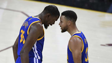 Jun 7, 2017; Cleveland, OH, USA; Golden State Warriors forward Kevin Durant (35, left) celebrates with guard Stephen Curry (30) against the Cleveland Cavaliers during the fourth quarter in game three of the 2017 NBA Finals at Quicken Loans Arena. 