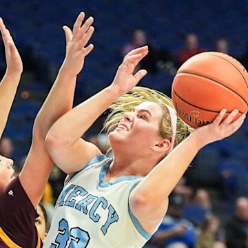 Mercy tries to score past Cooper in the first half Thursday during the girls’ basketball Sweet 16 tournament in Rupp Arena in Lexington, Kentucky. March 13, 2025