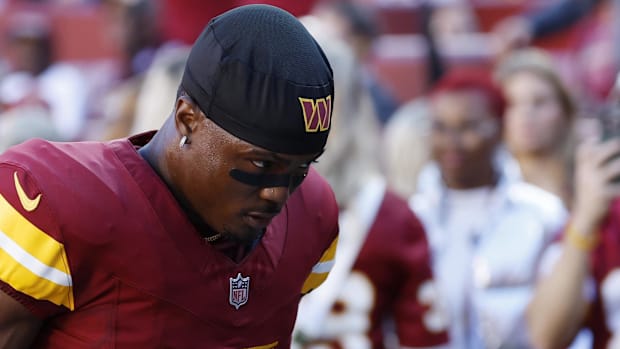 Washington Commanders wide receiver Terry McLaurin (17) walks off the field after warmup prior to the game