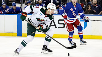 Apr 2, 2025; New York, New York, USA;  Minnesota Wild left wing Matt Boldy (12) controls the puck in the first period against the New York Rangers at Madison Square Garden. Mandatory Credit: Wendell Cruz-Imagn Images