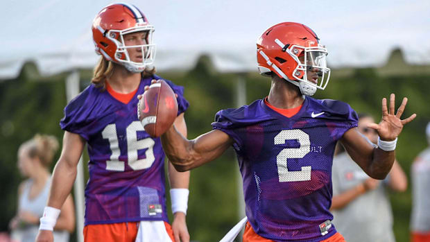 Clemson quarterback Kelly Bryant throws near quarterback Trevor Lawrence during the first day of practice