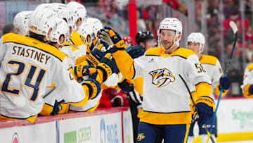 Mar 25, 2025; Raleigh, North Carolina, USA;  Nashville Predators left wing Michael Bunting (58) celebrates his goal against the Carolina Hurricanes during the first period at Lenovo Center. Mandatory Credit: James Guillory-Imagn Images
