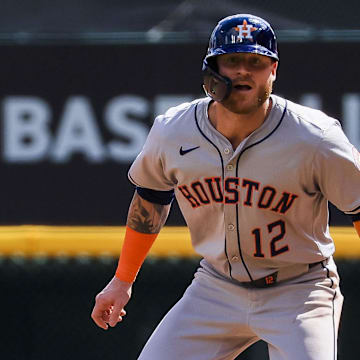 Sep 5, 2024; Cincinnati, Ohio, USA; Houston Astros outfielder Ben Gamel (12) leads off from first in the seventh inning against the Cincinnati Reds at Great American Ball Park.