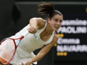 Jul 9, 2024; London, United Kingdom; Emma Navarro (USA) serves against Jasmine Paolini (ITA) (not pictured) in a ladies' singles quarter final match on day nine of The Championships Wimbledon 2024 at The All England Lawn Tennis Club.