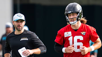 Jacksonville Jaguars quarterbacks coach Spencer Whipple, left, jogs with quarterback Trevor Lawrence (16) to the next drill during the Jacksonville Jaguars’ mandatory minicamp Tuesday June 10, 2025 at the Miller Electric Center in Jacksonville, Fla. 