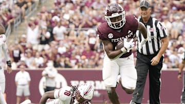 Oct 28, 2023; College Station, Texas, USA; Texas A&M Aggies running back Amari Daniels (4) runs against South Carolina Gamecocks during the second half at Kyle Field. Mandatory Credit: Dustin Safranek-Imagn Images