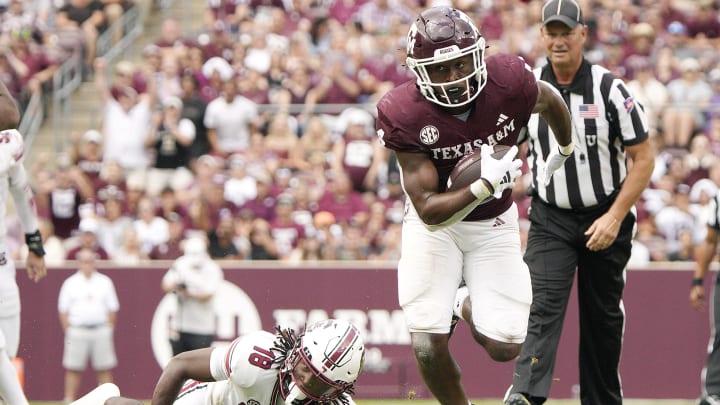 Oct 28, 2023; College Station, Texas, USA; Texas A&M Aggies running back Amari Daniels (4) runs against South Carolina Gamecocks during the second half at Kyle Field. 