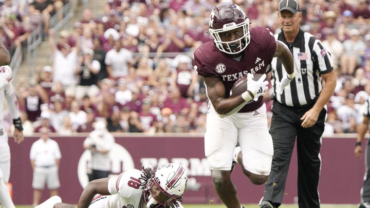 Oct 28, 2023; College Station, Texas, USA; Texas A&M Aggies running back Amari Daniels (4) runs against South Carolina Gamecocks during the second half at Kyle Field. Mandatory Credit: Dustin Safranek-USA TODAY Sports