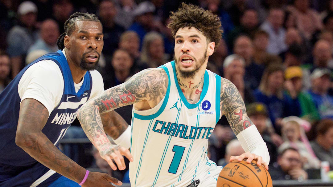 Apr 5, 2026; Minneapolis, Minnesota, USA; Charlotte Hornets guard LaMelo Ball (1) drives by Minnesota Timberwolves center Naz Reid (11) in the fourth quarter at Target Center. Mandatory Credit: Matt Blewett-Imagn Images