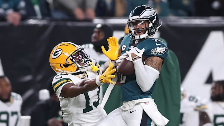 Jan 12, 2025; Philadelphia, Pennsylvania, USA; Philadelphia Eagles cornerback Darius Slay Jr. (2) makes an interception against Green Bay Packers wide receiver Dontayvion Wicks (13) during the first half in an NFC wild card game Jan 12, 2025; Philadelphia, Pennsylvania, USA; Philadelphia Eagles cornerback Darius Slay Jr. (2) makes an interception against Green Bay Packers wide receiver Dontayvion Wicks (13) during the first half in an NFC wild card game
