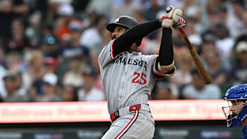 Jun 27, 2025; Detroit, Michigan, USA; Minnesota Twins center fielder Byron Buxton (25) hits a solo home run against the Detroit Tigers in the fifth inning at Comerica Park.