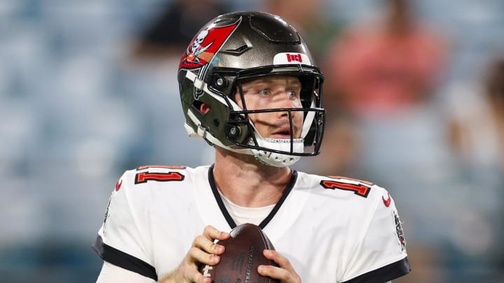 Aug 17, 2024; Jacksonville, Florida, USA; Tampa Bay Buccaneers quarterback John Wolford (11) drops back to pass against the Jacksonville Jaguars in the fourth quarter during a preseason game at EverBank Stadium. Mandatory Credit: Nathan Ray Seebeck-USA TODAY Sports