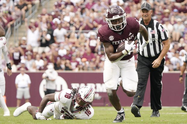 Texas A&M running back Amari Daniels (4) runs against the South Carolina Gamecocks during the second half at Kyle Field. 