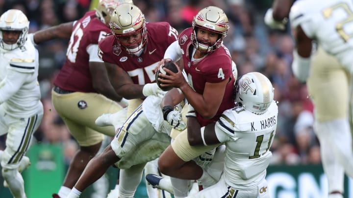 Aug 24, 2024; Dublin, IRL; Georgia Tech defensive lineman Kevin Harris II tackles Florida State University quarterback DJ Uiagalelei at Aviva Stadium. Mandatory Credit: Tom Maher/INPHO via USA TODAY Sports