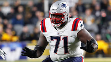 Dec 7, 2023; Pittsburgh, Pennsylvania, USA;  New England Patriots guard Mike Onwenu (71) blocks at the line of scrimmage against the Pittsburgh Steelers during the second quarter at Acrisure Stadium. Mandatory Credit: Charles LeClaire-Imagn Images