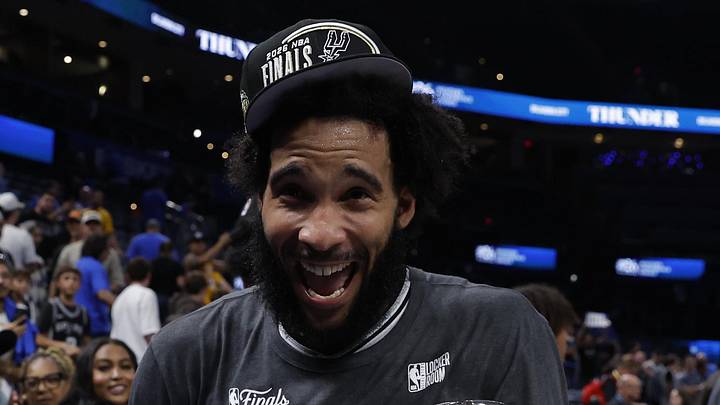 May 30, 2026; Oklahoma City, Oklahoma, USA; San Antonio Spurs forward Julian Champagnie (30) holds the NBA Western Conference Finals trophy after defeating the Oklahoma City Thunder in game seven of the western conference finals for the 2026 NBA playoffs at Paycom Center. Mandatory Credit: Alonzo Adams-Imagn Images