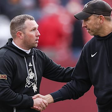 Nov 1, 2025; Ames, Iowa, USA; Arizona State Sun Devils head coach Kenny Dillingham and Iowa State Cyclones head coach Matt Campbell shake hands after the game at Jack Trice Stadium. Mandatory Credit: Reese Strickland-Imagn Images