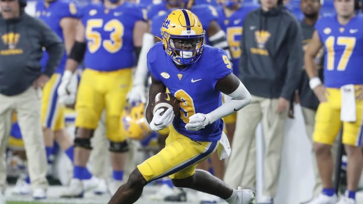 Nov 4, 2023; Pittsburgh, Pennsylvania, USA;  Pittsburgh Panthers wide receiver Konata Mumpfield (9) runs after a catch against the Florida State Seminoles during the fourth quarter at Acrisure Stadium. The Seminoles won 24-7. Mandatory Credit: Charles LeClaire-USA TODAY Sports