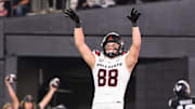 Oct 19, 2024; Nashville, Tennessee, USA;  Ball State Cardinals tight end Tanner Koziol (88) celebrates his touchdown with tight end Christian Abney (87) against the Vanderbilt Commodores during the second half at FirstBank Stadium. Mandatory Credit: Steve Roberts-Imagn Images