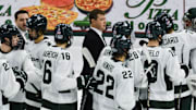 MSU hockey coach Adam Nightingale and his Spartans gather on the ice following MSU's 4-3 win over Notre Dame, Saturday, Nov. 15, 2024.