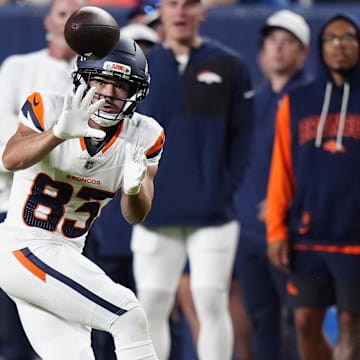 Aug 16, 2025; Denver, Colorado, USA; Denver Broncos wide receiver Michael Bandy (83) prepares to catch the ball in the second quarter against the Arizona Cardinals at Empower Field at Mile High. 