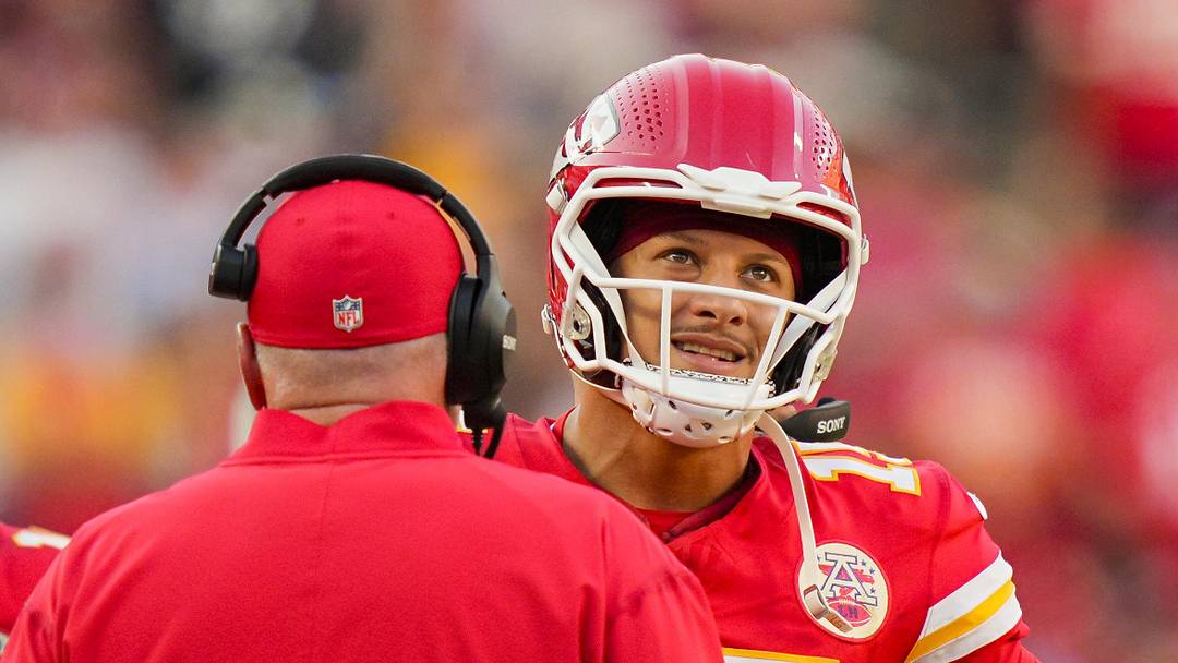 Sep 28, 2025; Kansas City, Missouri, USA; Kansas City Chiefs quarterback Patrick Mahomes (15) talks with head coach Andy Reid during the second half against the Baltimore Ravens at GEHA Field at Arrowhead Stadium. Mandatory Credit: Jay Biggerstaff-Imagn Images