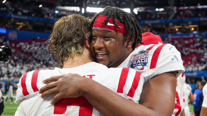 Dec 30, 2023; Atlanta, GA, USA; Mississippi Rebels quarterback Jaxson Dart (2) celebrates with defensive end Jared Ivey (15) after a victory against the Penn State Nittany Lions in the Peach Bowl at Mercedes-Benz Stadium. Mandatory Credit: Brett Davis-USA TODAY Sports